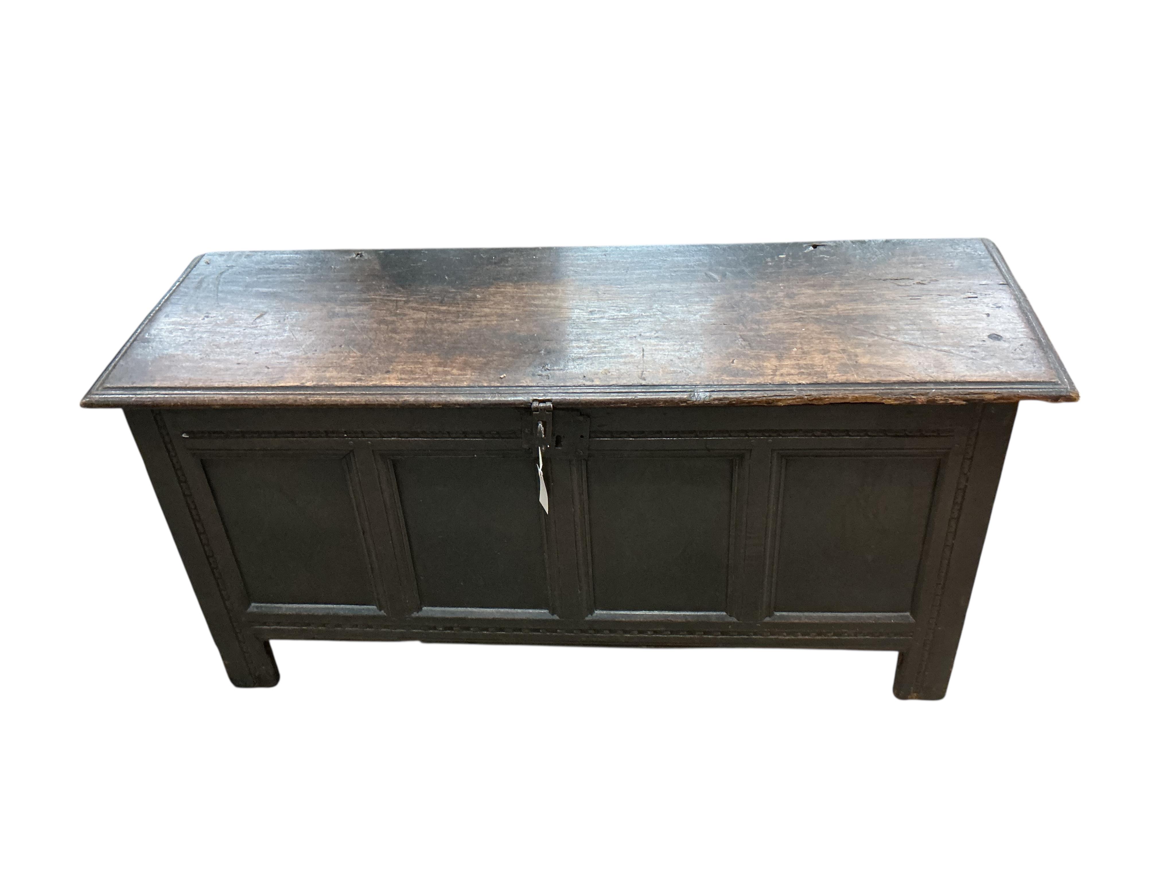 An 18th century panelled oak coffer, width 138cm, depth 46cm, height 64cm